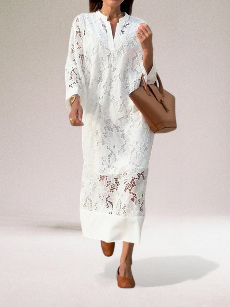 Allsidig hvit elegant kvinnekjole, ideell for vår, sommer, fest og selskap. En tidløs og penkjole.