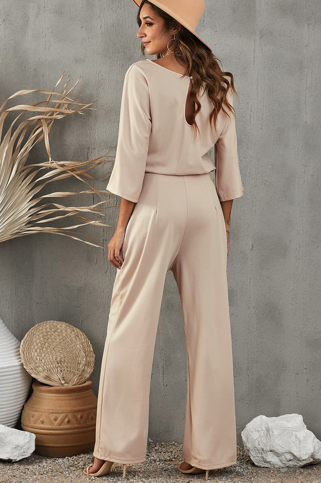 Damejumpsuit med brede ben, midjebelte og trekvart ermer for allsidig bruk.