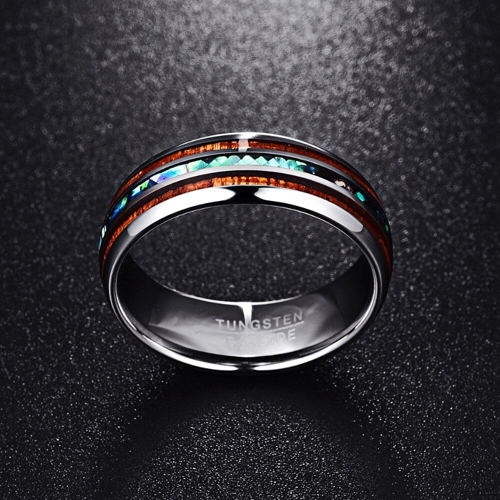 Hawaiisk Koa tre ring for kvinner med glitrende abalone og robust wolframkarbid, et elegant smykke.