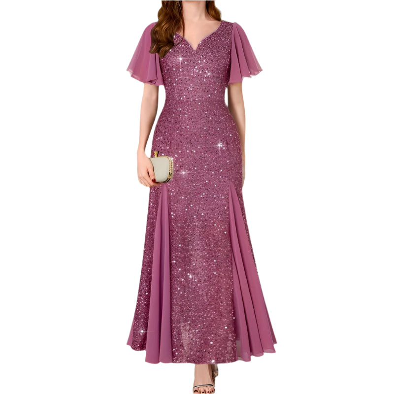 Elegant kvinne maxikjole i polyester med hjerteutskjæring. Perfekt festkjole eller aftenkjole med glitter.