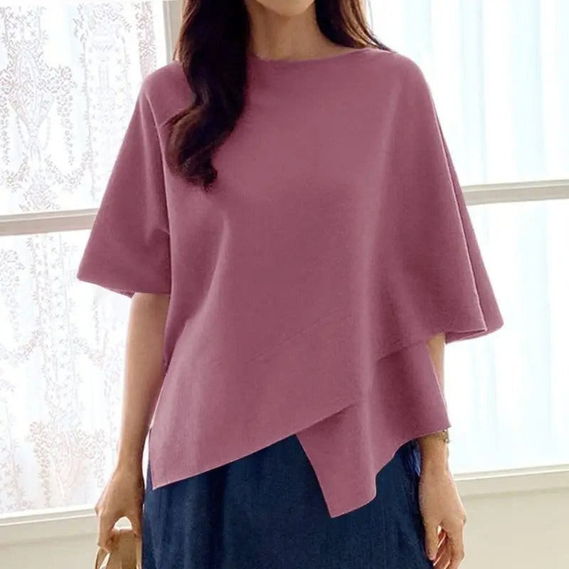 Feminine volanger på 3/4-ermet bluse for kvinner, gir et elegant og moderne uttrykk.