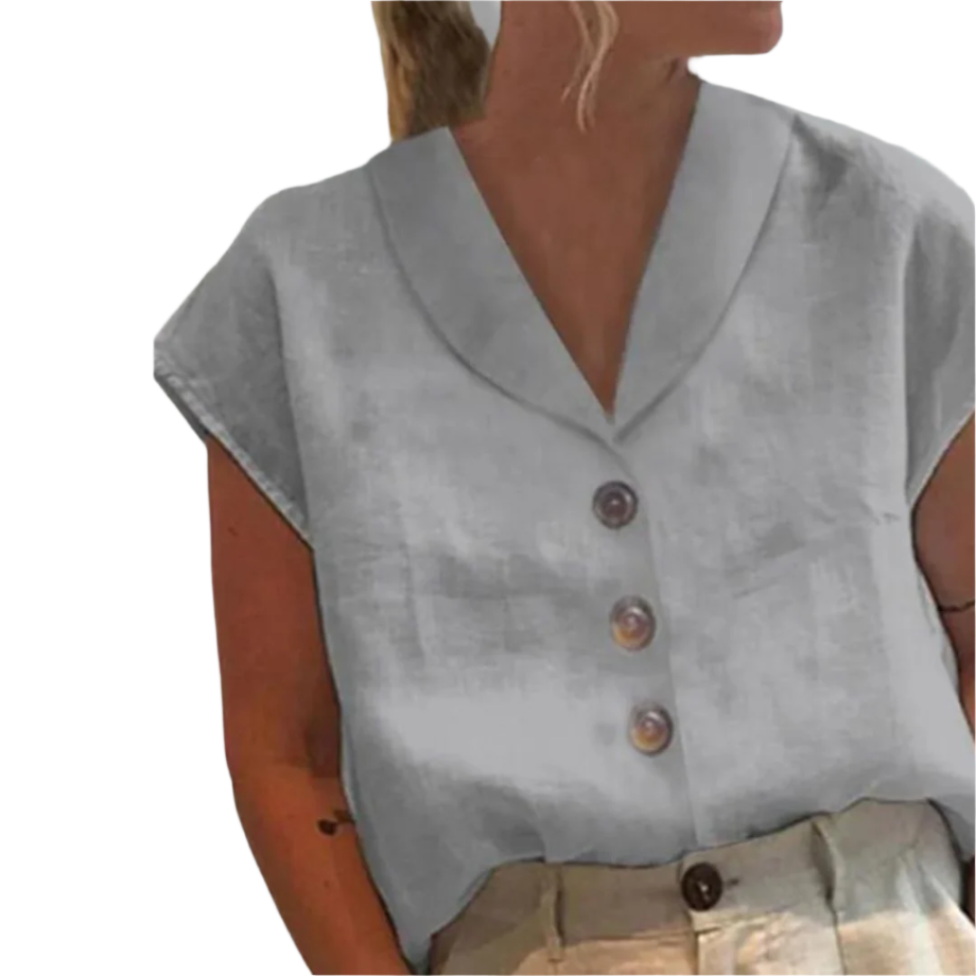 Elegant kvinnebluse med bred krage, moderne store knapper, perfekt for jobb og fritid.