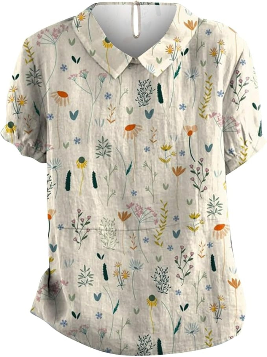 Elegant kvinnebluse med delikat blomsterprint i pastellfarger. Perfekt sommerbluse for fritid og hverdagsbruk.