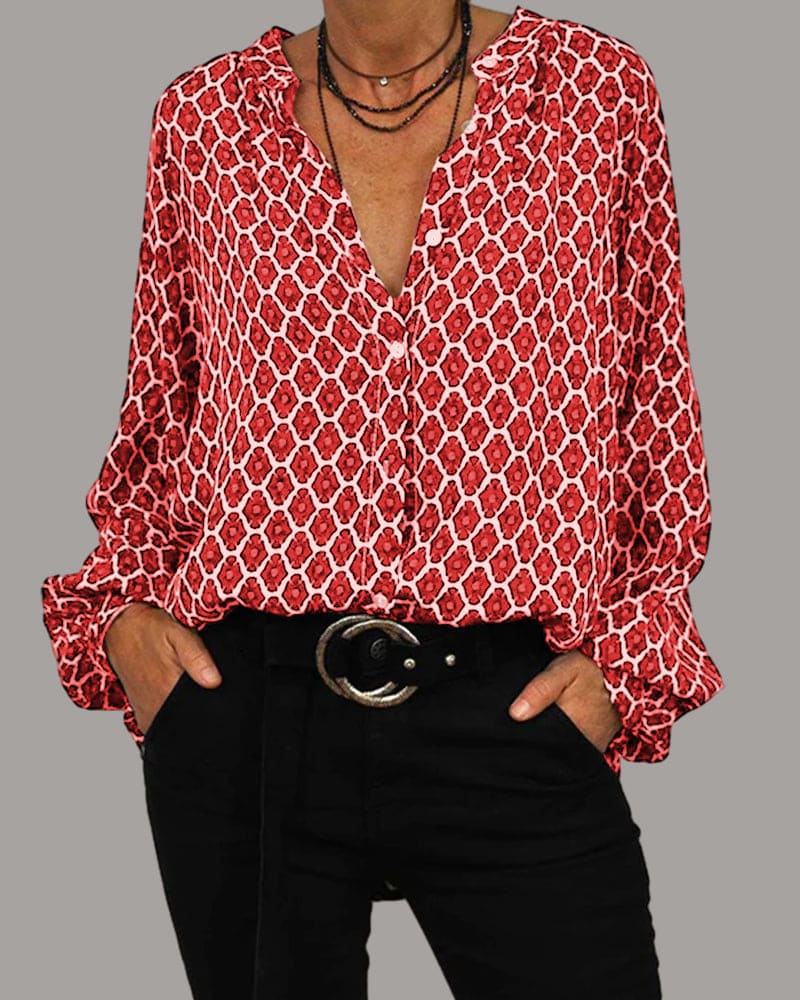 Motebluse med geometrisk mønster og lange ermer. Komfortabel V-hals kvinnebluse for en elegant look.