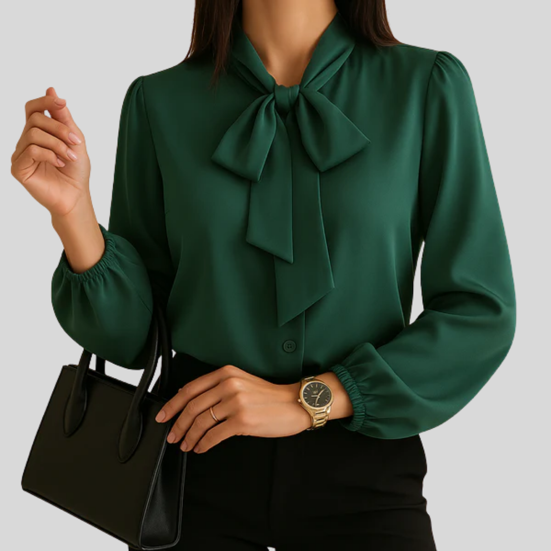Elegant kvinners bluse med lang erm og delikat sløyfedetalj i halsen. Perfekt jobbantrekk eller festtopp.