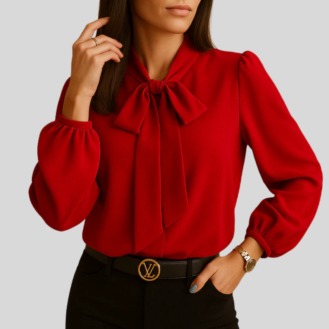 Svart elegant damebluse med sløyfe ved halsen. En stilig topp for både jobb, fest og fritid.