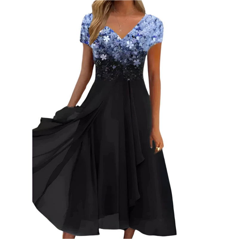 Elegant midi damekjole med fargerikt blomstermønster, V-hals og korte ermer. Perfekt sommer- eller festkjole.