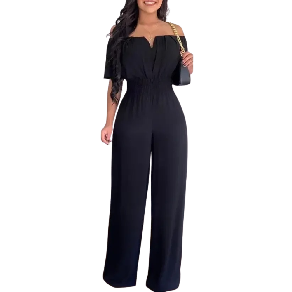Modell i stilfull off-shoulder jumpsuit med vide ben. Komfortabelt festantrekk og moderne dameklær.