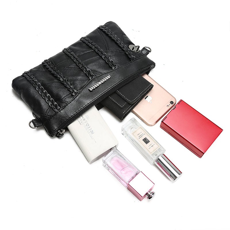 Chic crossbody clutchveske med metall-detaljer, ideell for et sofistikert antrekk og tilbehør.