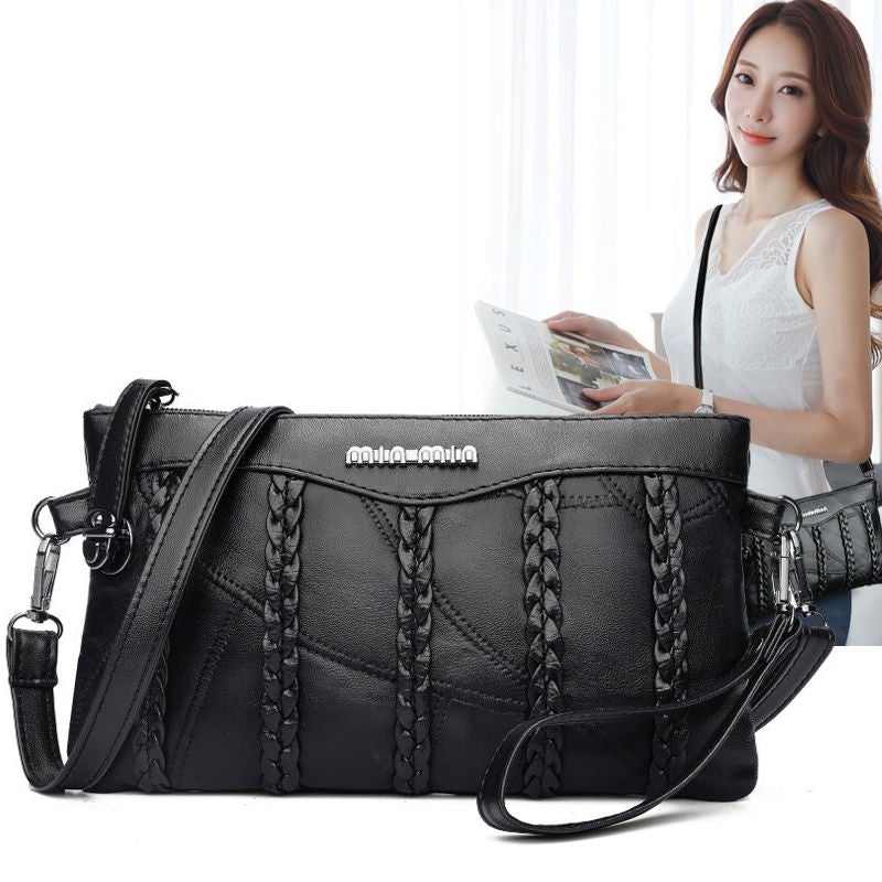 Elegant dameveske i slitesterkt materiale, en allsidig veske som passer både som clutch og crossbody.