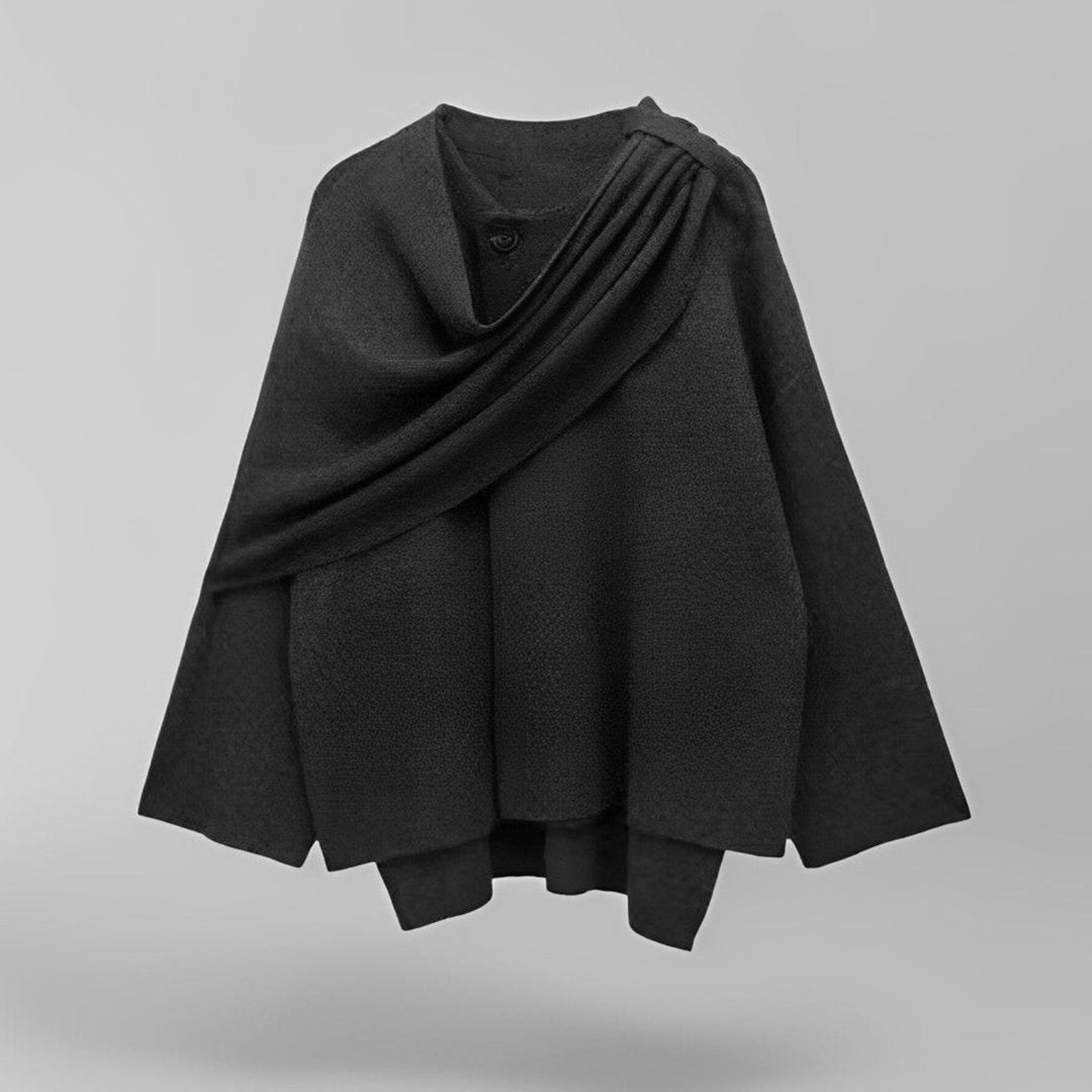 Elegant svart dame cape frakk med flytende drapering, et stilfullt ytterplagg perfekt for lagdeling i overgangsvær.