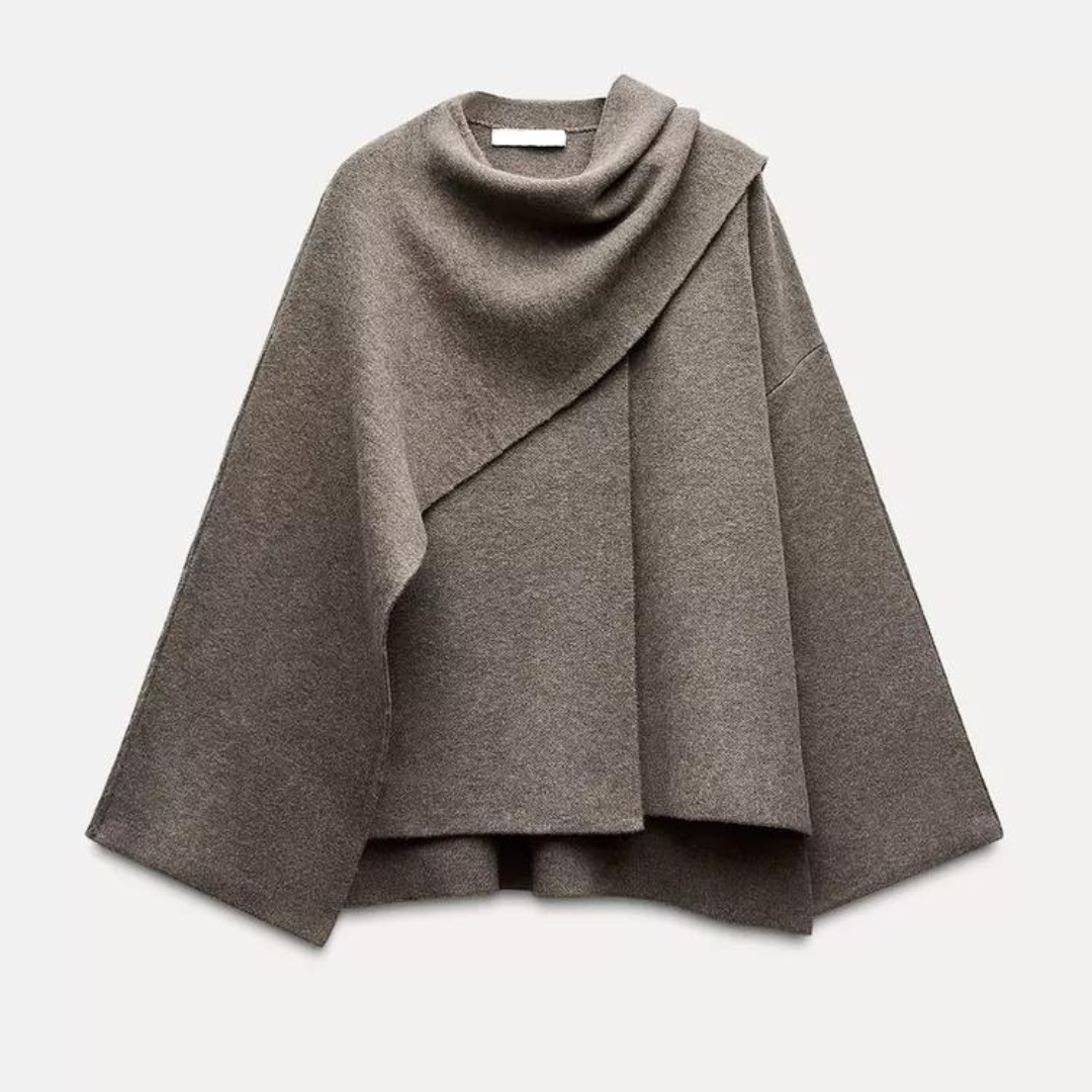 Grå kvinners cape frakk med løs passform og elegant drapering. Ideell for motebevisste kvinner, også tilgjengelig i svart.