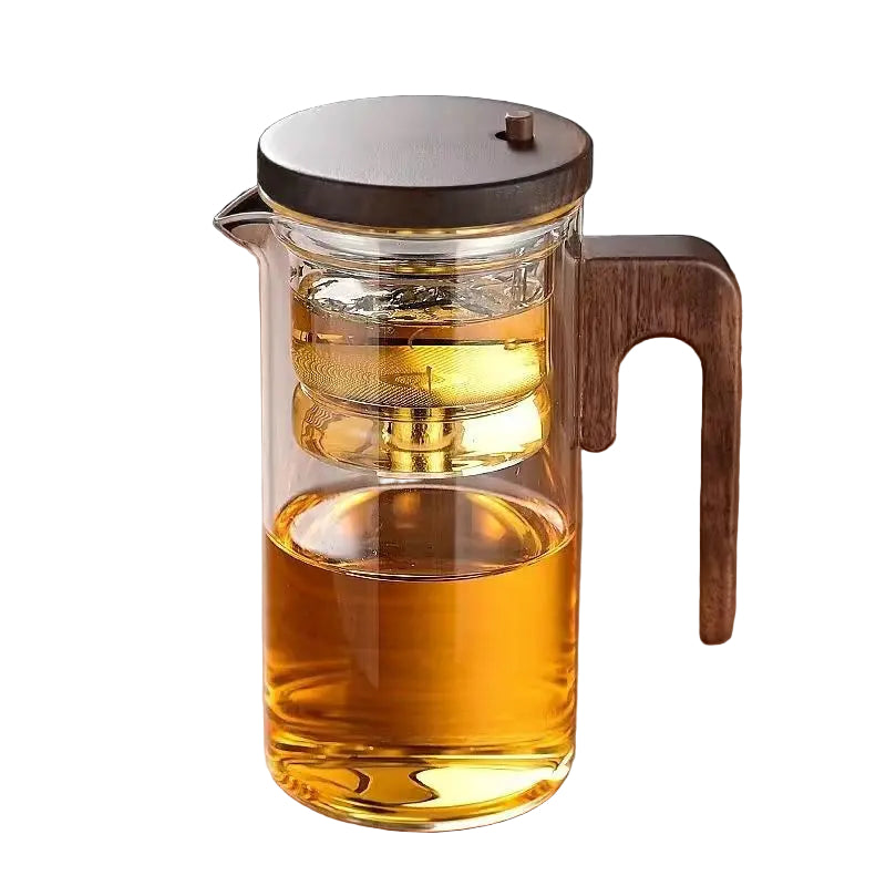 Elegant tekanne med infuser for løs te; perfekt for brygging og servering hjemme.