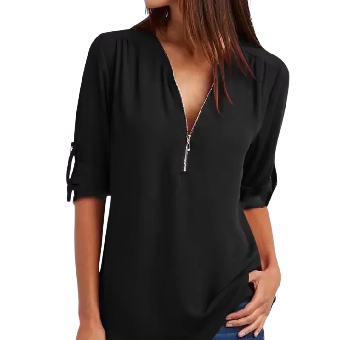 Elegant V-hals bluse for kvinner i luftig stoff, perfekt for fest og hverdag. Komfortabel løs passform.