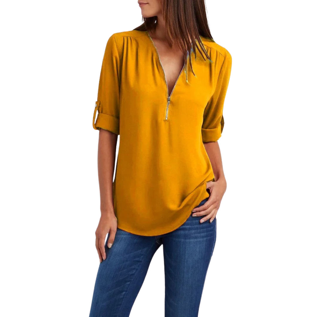 Elegant festtopp med V-hals for damer. Komfortabel bluse med løs passform, perfekt for vår og sommer.