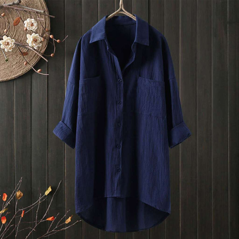 Damebluse med løs passform og lange ermer. Ensfarget skjorte med knapper, ideell for et elegant arbeidsantrekk.