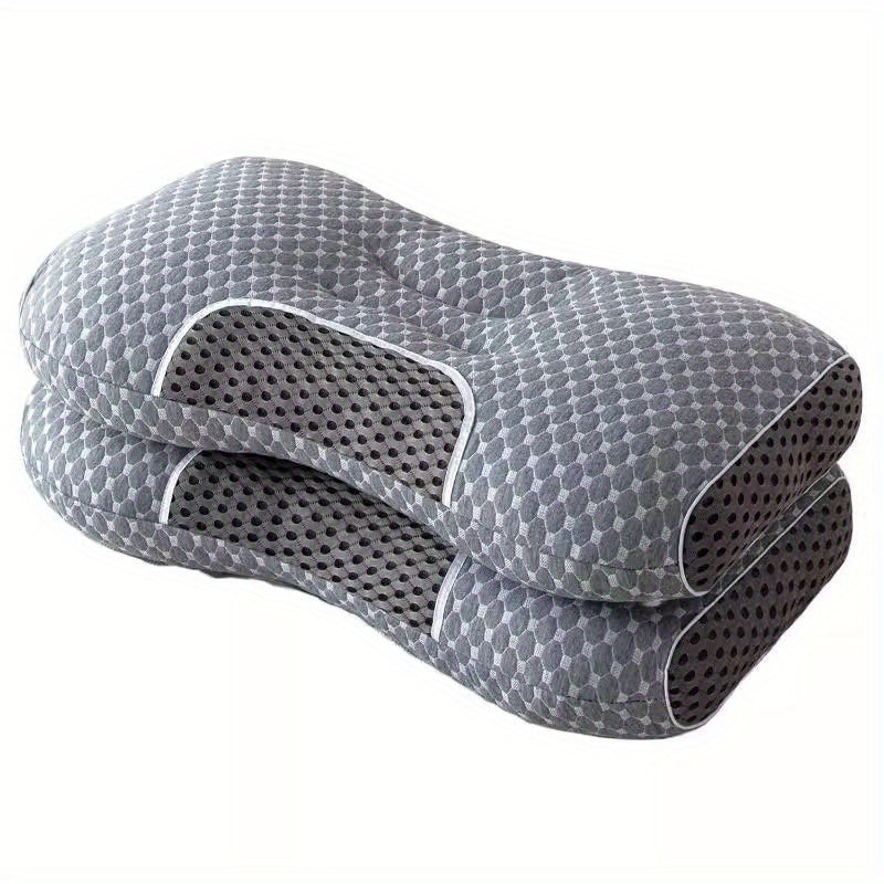 Ergonomisk nakkepute i grått design for optimal søvn og komfort. Gir god støtte for nakken.