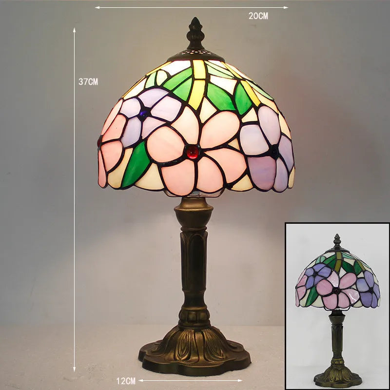 Fleksibel bordlampe med fargerikt glassdesign, ideell som leselampe for arbeidsplassen eller soverommet.