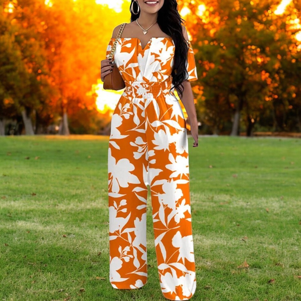 Komfortabel damejumpsuit med trykk, skulderfri topp og smockmidje som fremhever midjen flatterende.