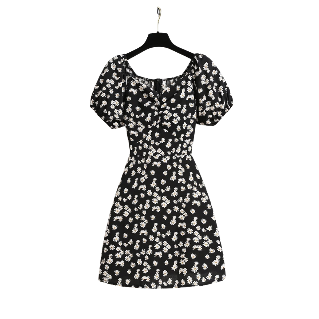 Feminin blomstret minikjole for kvinner med elegante puffermer, perfekt for sommerdager.