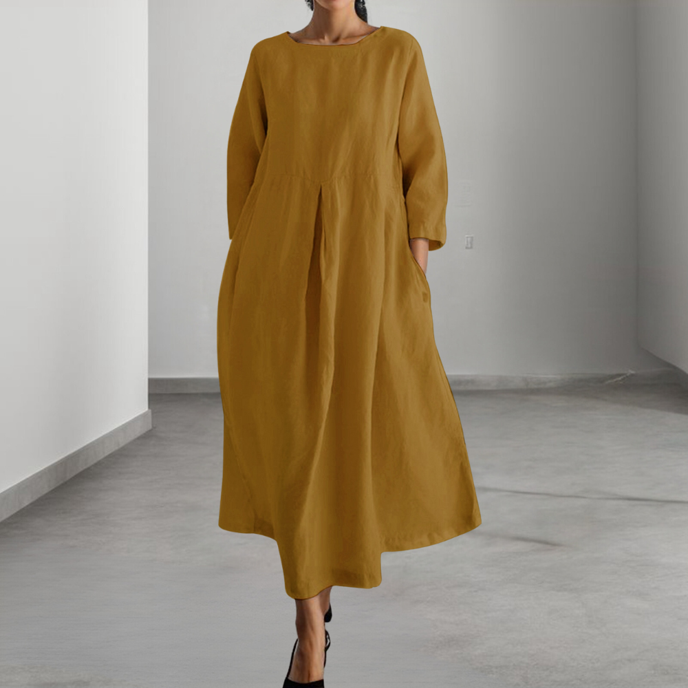 Elegant beige damekjole, perfekt for hverdag eller fest. En allsidig og lett sommerkjole.