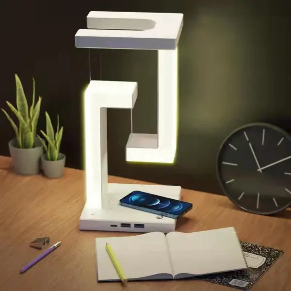 Innovativ bordlampe med trådløs lading, futuristisk tensegrity-design og USB-strøm. Ideell for moderne interiør.