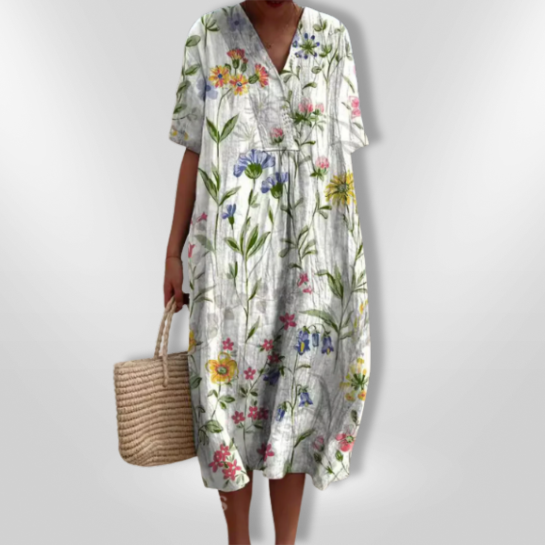 Freizeit-Damenkleid für den Sommer, locker geschnitten, mit V-Ausschnitt und buntem Blumendesign.