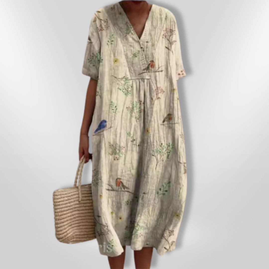 Rückenansicht eines eleganten Damen Maxikleids mit Blumenprint, locker und sommerlich.