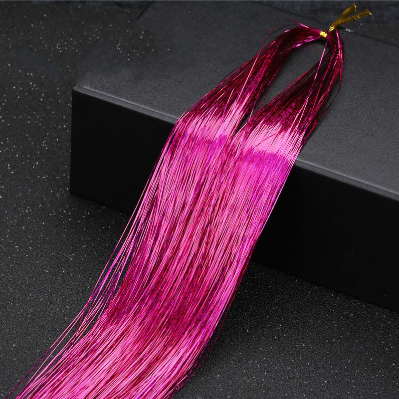 Fargerike tinsel extensions, legg til et glamorøst preg til ethvert hår.