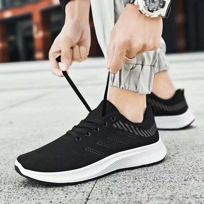 Lettvekt pustende herre joggesko i grått, perfekt for utendørs løping, trening og komfortabel fritidsbruk.