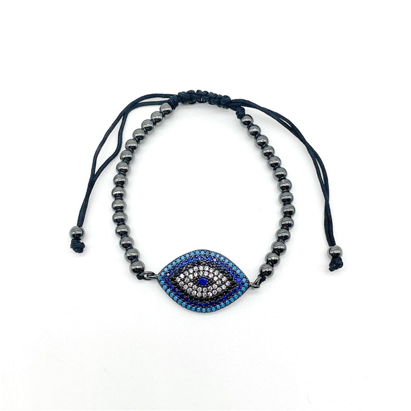 Funklende dame armbånd med onde øye og innfattet kubisk zirkonia. Et stilfullt og spirituelt smykke i høy kvalitet.