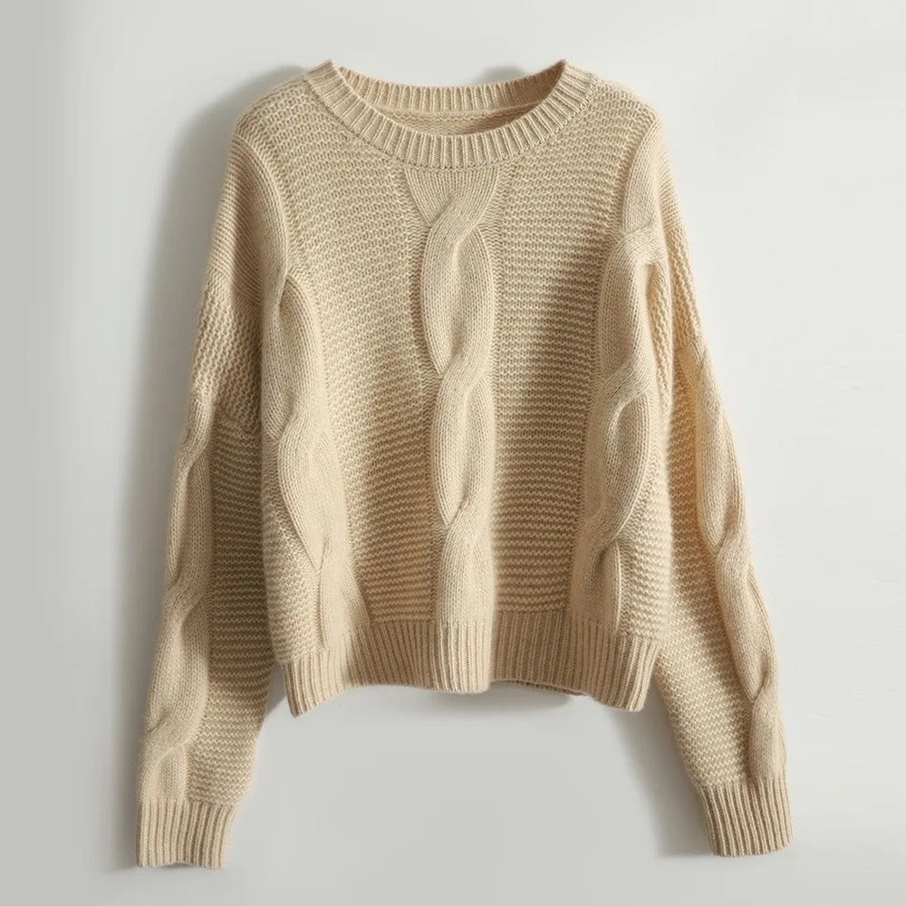 Elegant håndstrikket damegenser med rundhals i 100% myk bomull. Ideell for casual eller lag-på-lag styling.