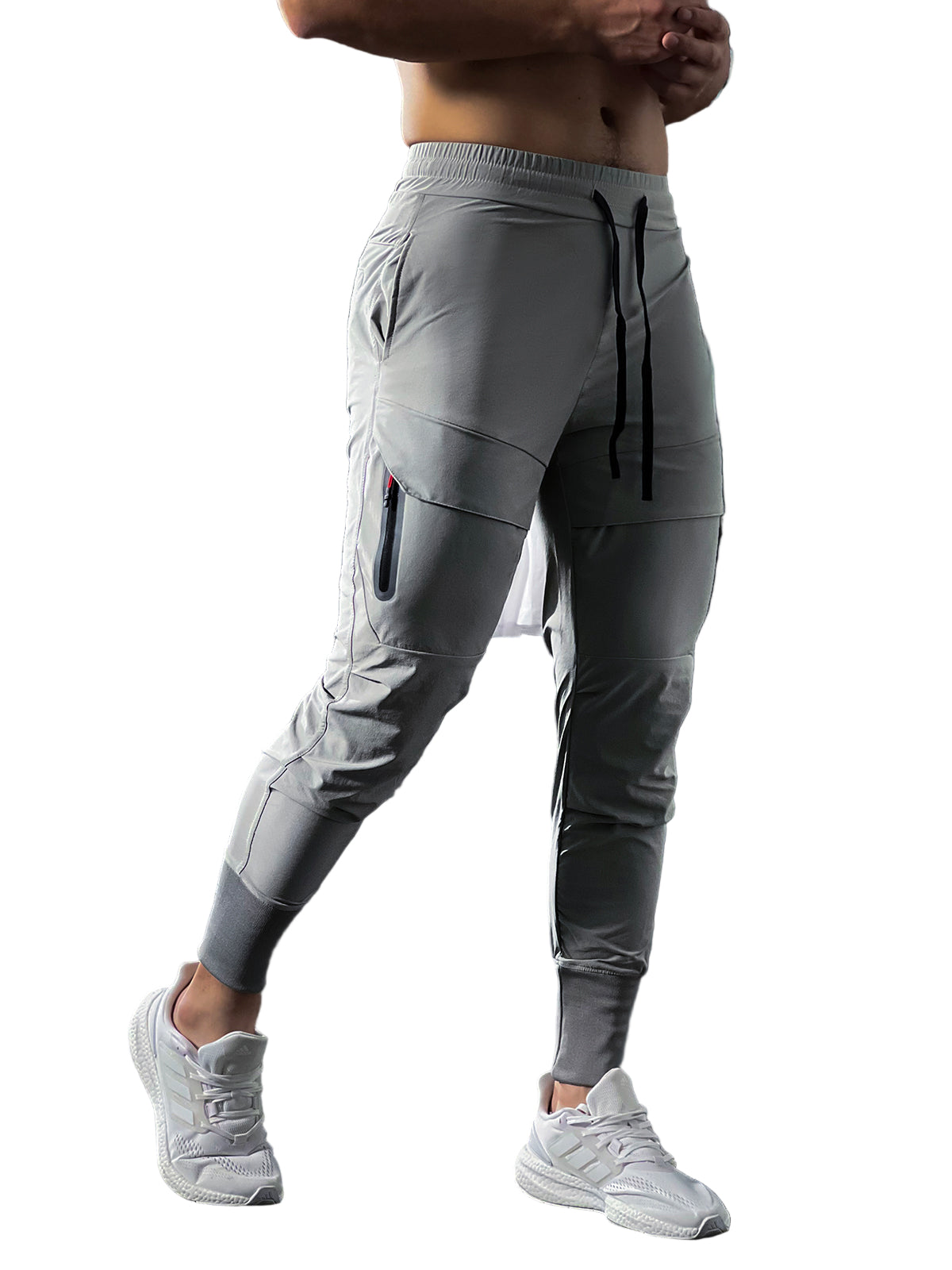 Herre slim fit treningsbukse i sort for optimal komfort. Pustende sportsklær med glidelåslommer.