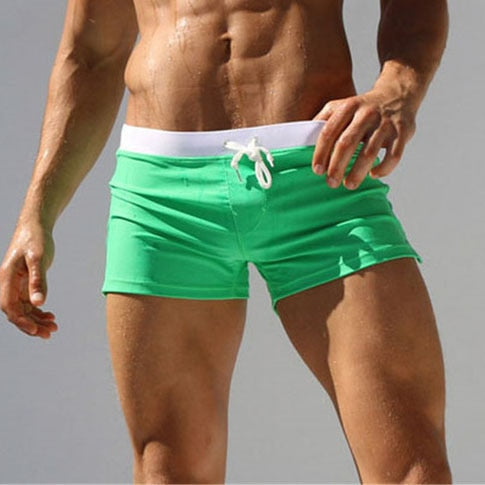Blå boardshorts for menn, lette og hurtigtørkende, optimal badetøy for sommeren.