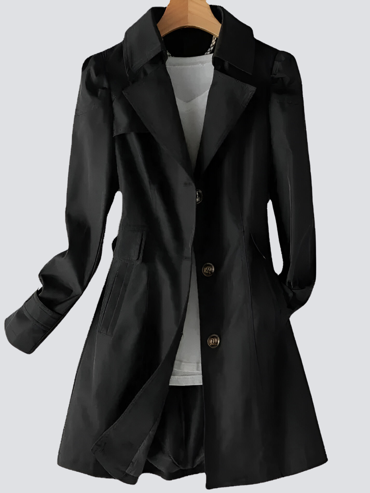 Kvinne i elegant beige kvinners trenchcoat. Klassisk ytterplagg for vår og høst, perfekt for en tidløs stil.