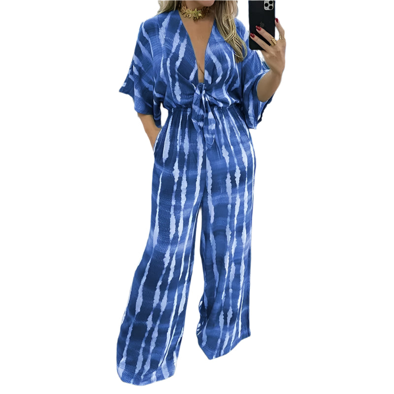 Elegant grønn dolman-ermet jumpsuit for kvinner med v-hals og vide ben, ideell for sommer.
