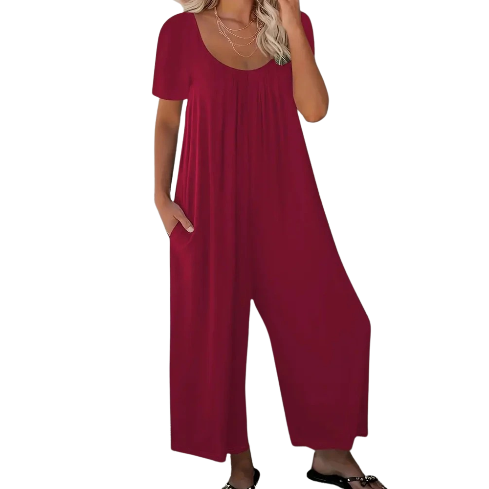 Mote jumpsuit for kvinner: ensfarget, kortermet, vide ben og praktiske lommer. Komfortabel for sommeren.