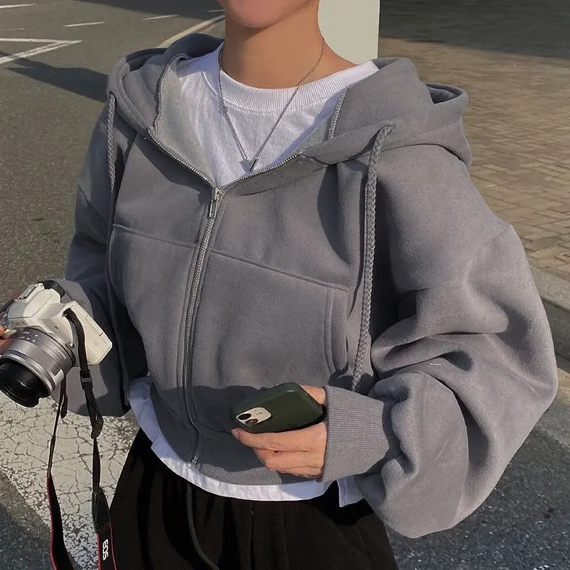Hverdags sweatshirt med glidelås for kvinner. En overdimensjonert hettegenser som kombinerer stil og komfort.
