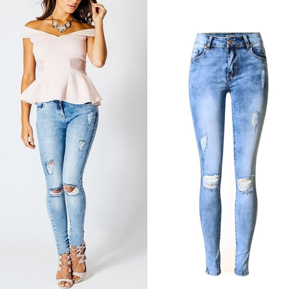 Dame skinny jeans, bakfra, med diskrete lommer som fremhever den elegante slimfit-silhuetten.