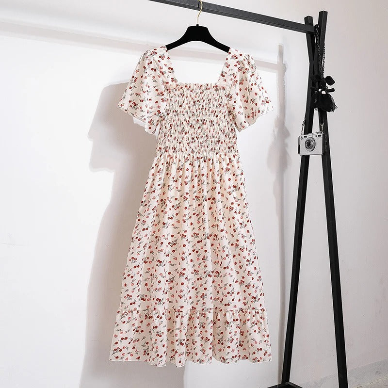 Elegant blomstret midikjole for kvinner, ideell som sommerkjole, festkjole eller stilfullt hverdagsantrekk.