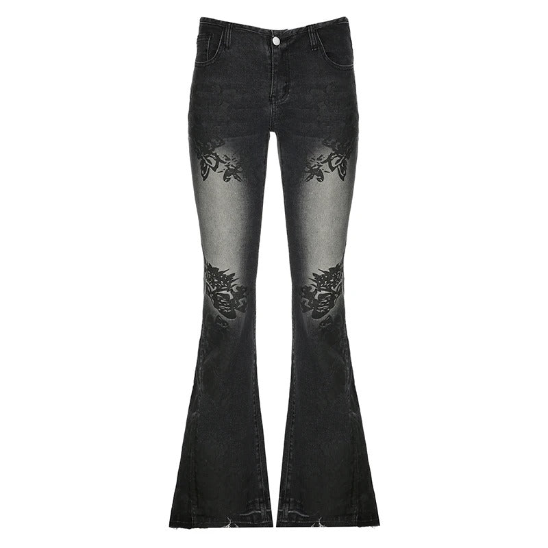 Kvinner jeans med lav midje, blomstertrykk. Retro slengbukser for vår og sommer.