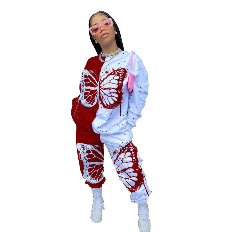 Kvinner sommerfugl print treningsdress. Komfortabel todelt hettegenser og bukser for fritid og sport.