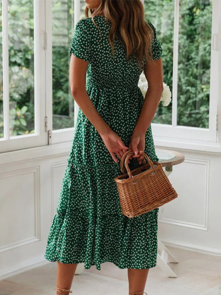 Avslappet, elegant blomstret maxikjole. Kvinners kjole med vintagestil, puffermer og firkantet hals.
