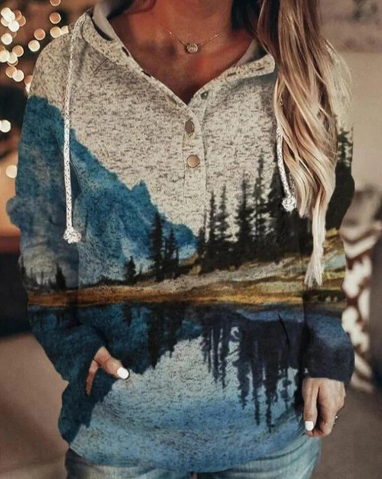 Komfortabel kvinners fritidsgenser med fjellmotiv, perfekt for vinter og høst.
