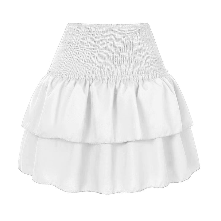 Kvinners sommerskjørt. Høy midje, lekne volanger og lett a-linje design. Smocket midje.