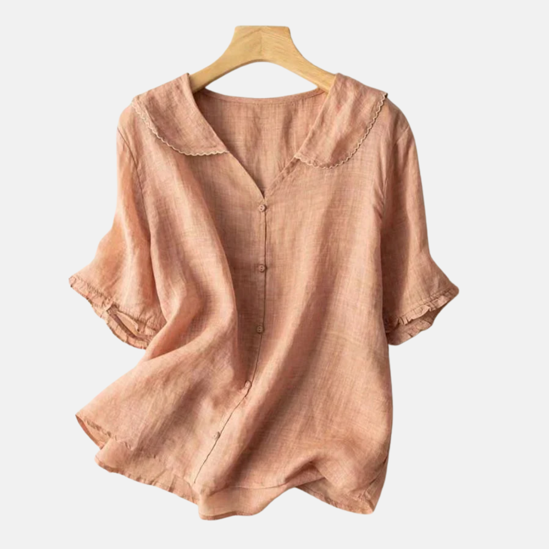 Kvinners retro bomull lin skjorte med dukke krage i oransje. Elegant vår/sommer topp i pustende stoff.