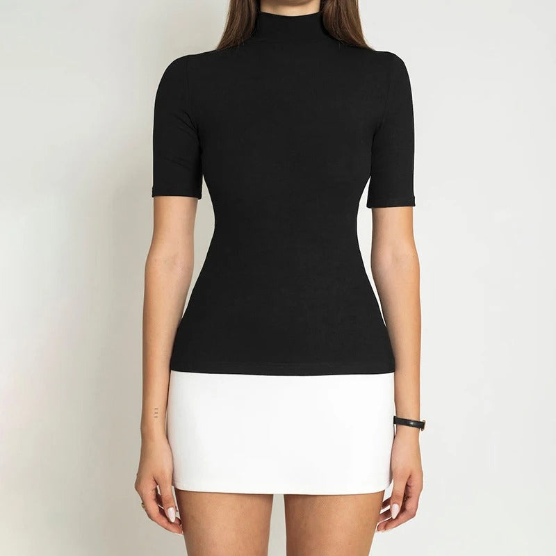 Stilig bodycon kjole i patchwork for festantrekk eller kveldsantrekk, med høy hals.