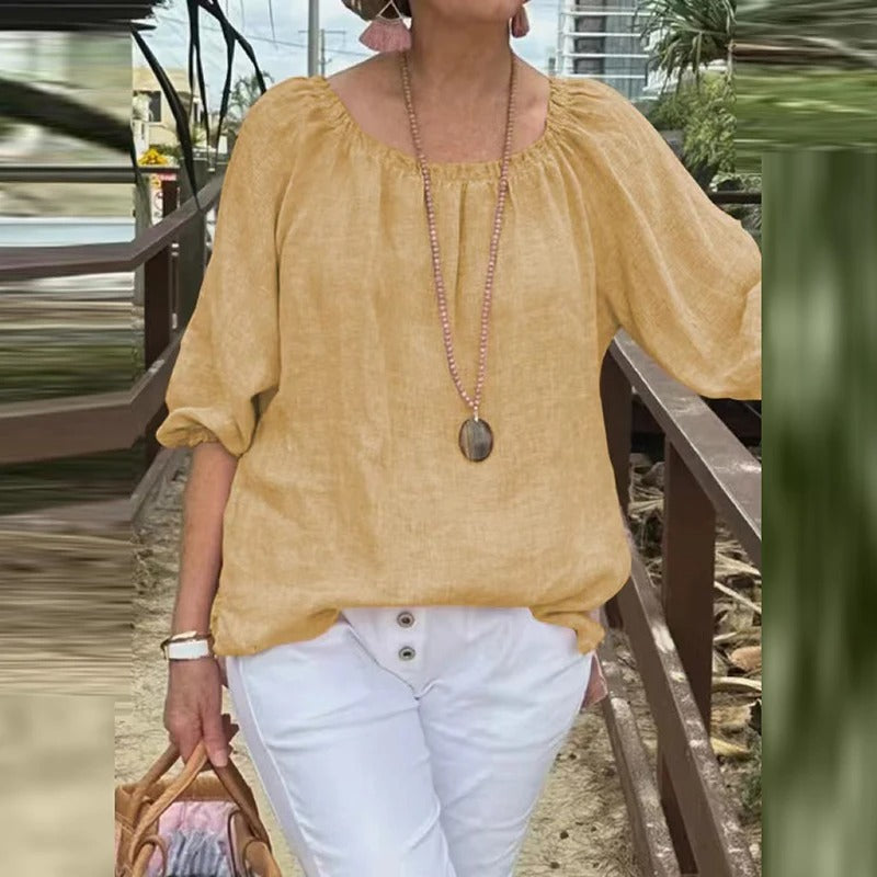 Dame halv-ermet bluse, løs passform, perfekt for en komfortabel og moderne look.