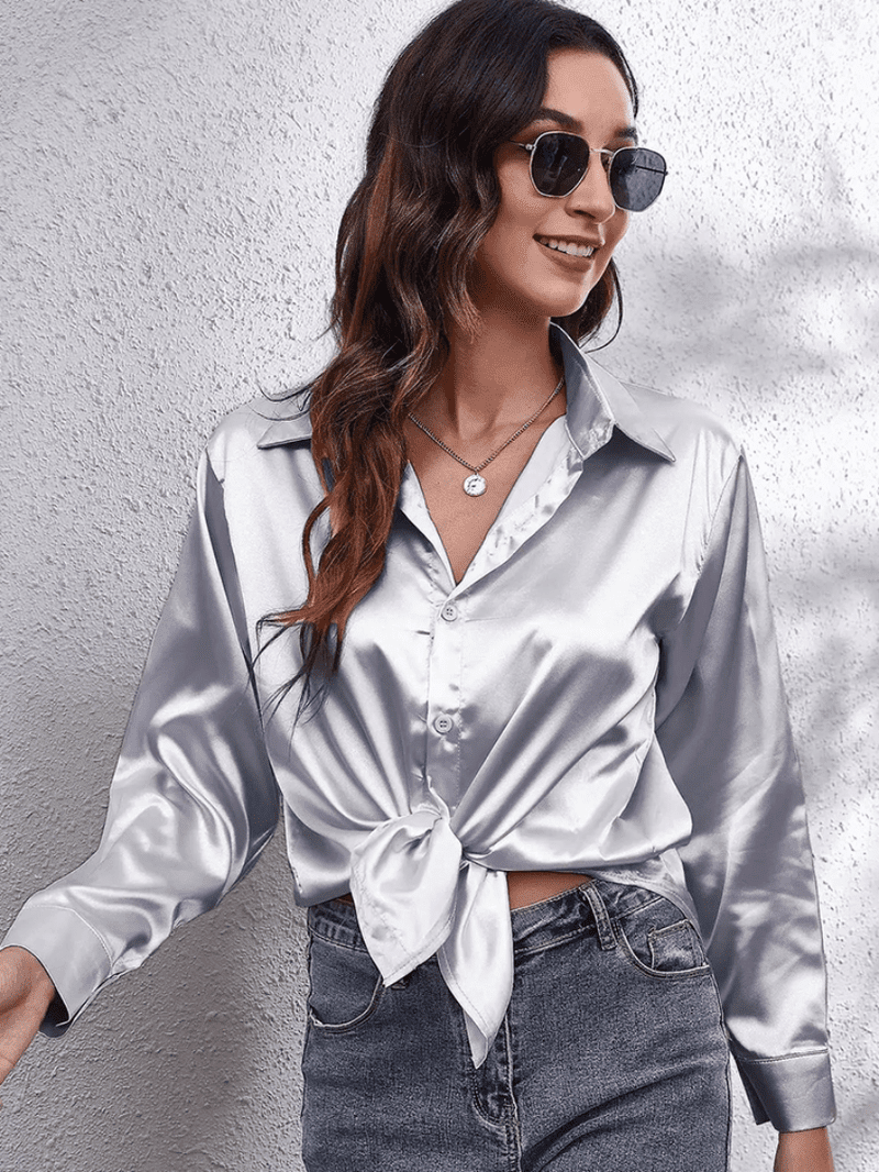 Motebevisst langermet festbluse, elegant og komfortabel for spesielle anledninger.
