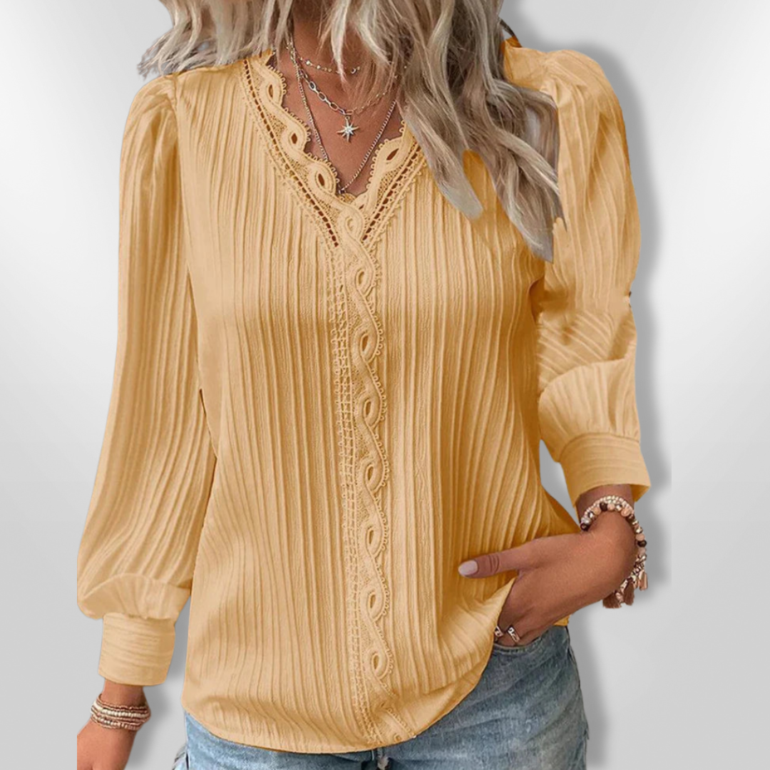 Detaljert langermet kvinnebluse med elegant snitt, en flott hverdagsbluse eller festtopp.